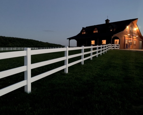 3-rail vinyl equestrian fence at a country home
